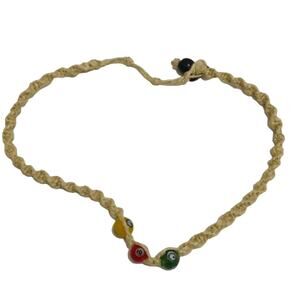 Woven green, red, yellow eye necklace